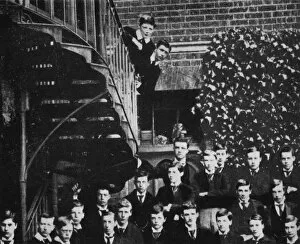 Benjamin Tucker Collection: Winston climbing a staircase, while the class pose, c1889, (1945)