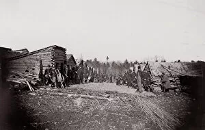 Us Army Gallery: [Winter Quarters, troops with row of cabins]. Brady album, p. 128, 1861-65