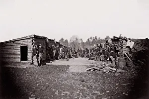 [Winter Quarters, troops with row of cabins]. Brady album, p. 128, 1861-65