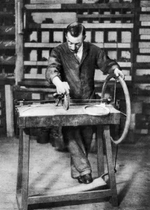 Wire being wound into springs for spring-locks, London, 1926-1927 Wire being wound into springs for spring-locks, London, 1926-1927