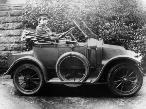 Running Board Prints: Woman in a 1911 convertible Renault AX, c1911