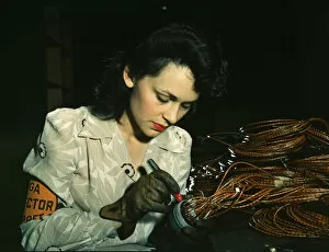 Airplane Industry Gallery: Woman aircraft worker, Vega Aircraft Corporation, Burbank, Calif. 1942. Creator: David Bransby
