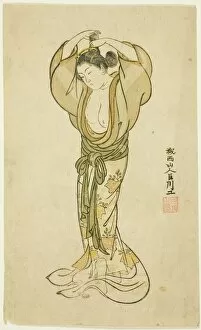Toilette Collection: Woman Arranging Her Hair, Japan, 1765. Creator: Kyosen