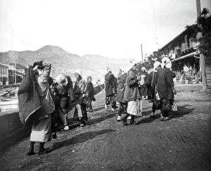 Nagasaki Prints: Woman carrying loads of coal, Nagasaki, Japan, c1900