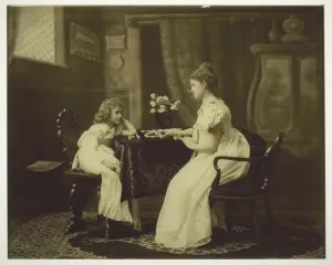 Woman and Child Playing Dominoes at Table, c. 1898. Creator: Unknown