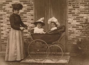Woman and children in a pushchair, 1937