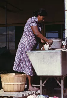 Washing Collection: Woman at the community laundry on Saturday afternoon, FSA... camp, Robstown, Tex. 1942
