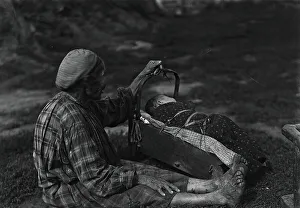 Yakutia Prints: A woman with a cradle, 1890. Creator: Unknown