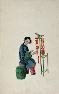 Traditional Culture Prints: A woman displaying good luck tassels for sale, 1800. Creator: Unknown