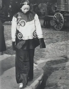 Chinese American Prints: A woman in holiday attire, Chinatown