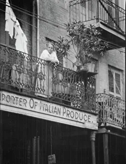Balcony Rail Prints: Woman leaning on a balcony, New Orleans, between 1920 and 1926. Creator: Arnold Genthe