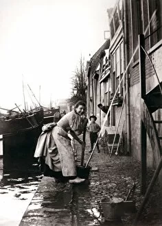 Dordrecht Gallery: Woman mopping the street, Dordrecht, Netherlands, 1898.Artist: James Batkin
