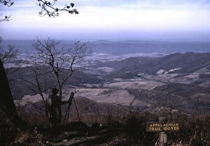 A woman painting a view of the Shenandoah Valley...entrance to the Appalachian Trail, Va, ca. 1940
