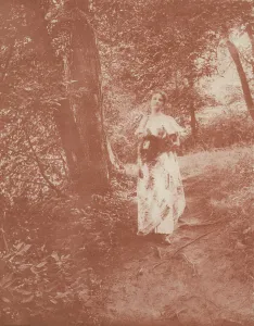 Woman on path in the woods, c1900. Creator: Mary A. Bartlett