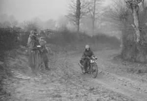 Royal Enfield Prints: Woman riding a Royal Enfield motorcycle in the Gloucester Trial