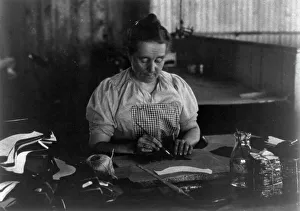 Shoemaking Prints: Woman seated at a table, working in a shoe factory