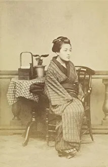 Woman sitting by table, about 1868. Creator: Felice Beato
