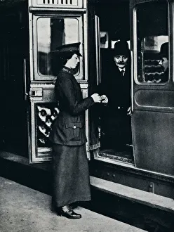 A woman ticket inspector at work, c1914 A woman ticket inspector at work, c1914