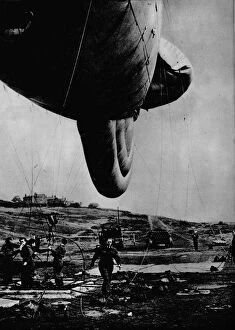 Blitz Gallery: Woman of the WAAF handling a barrage balloon, 1943