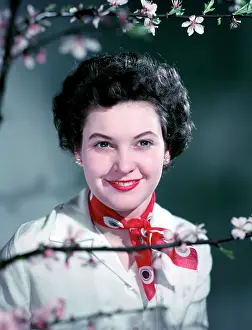 Blossom Prints: Woman wearing a red neck scarf, c1955. Creator: Arthur Charles Kirby Ware