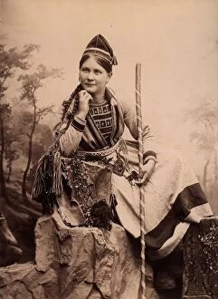 Leaning Collection: Woman wearing Sami folk costume, Inga Åren, Frostviken, Lapland, 1890-1900. Creator: Helene Edlund