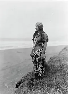 Necklaces Prints: Woman's primitive dress-Tolowa, c1923. Creator: Edward Sheriff Curtis
