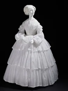 Flounce Prints: Woman's white muslin dress with tiered flounces, Europe, c.1855. Creator: Unknown