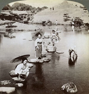 Images Dated 17th July 2008: Women crossing the lake on stepping stones, Suizen-ji Garden, Kumamoto, Japan
