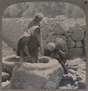 Women drawing water at the Fountain of the Magi, on the road to Bethlehem, c1900
