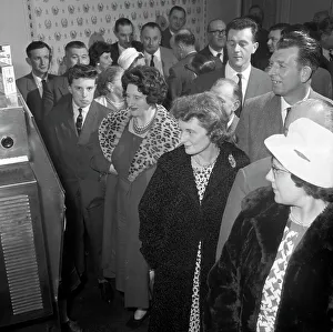 Women in fur coats at a food exhibition, Wilsic, near Doncaster, South Yorkshire, 1961