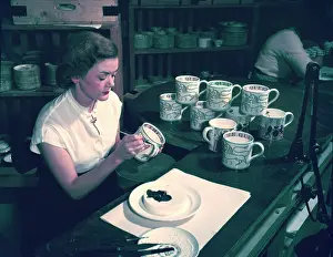 Commemorative Prints: Women hand decorating souvenir mugs commemorating the Coronation of Elizabeth II