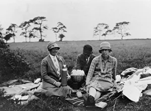 Picnic Prints: Three women having a picnic in a field, (1920s?)