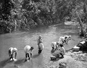 Washing Collection: Women washing clothes in the river, Port Antonio, Jamaica, c1905. Artist: Adolphe Duperly & Son