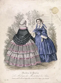 Two women wearing the latest fashions in a garden setting, 1858