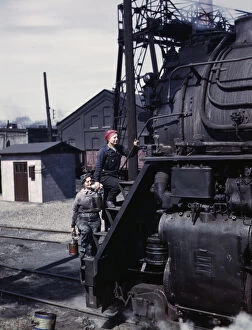 Chicago And North Western Railway Gallery: Women wipers of the Chicago and North Western Railroad cleaning one of the... Clinton, Iowa, 1943