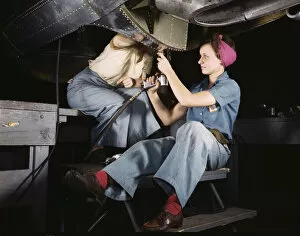Women At Work Collection: Women at work on bomber, Douglas Aircraft Company, Long Beach, Calif. 1942. Creator: Alfred T Palmer