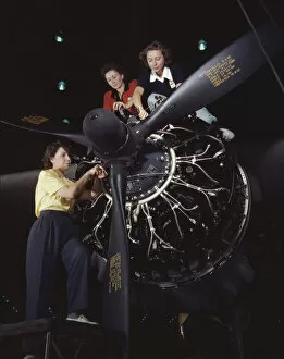 Assembly Line Worker Collection: Women at work on C-47 Douglas cargo transport, Douglas Aircraft Company, Long Beach, Calif. 1942