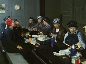 Women workers employed as wipers in the roundhouse having lunch..., C&NWRR., Clinton, Iowa, 1943. Creator: Jack Delano