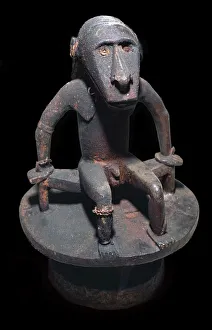 Solomon Islands Prints: Wooden figure of a sea spirit, with head in the form of a shark, from the Solomon Islands