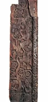 Wooden portal of Hylestad church, showing Sigurd roasting the dragons heart