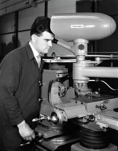 Precision Prints: Worker using a cutting machine
