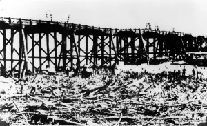 British Colony Prints: Workers below Victoria Bridge, cleaning up debris after the flood