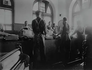 Making Prints: Workers wetting sheets prior to printing paper money at the Bureau of Engraving & Printing