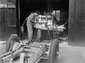 Mays Gallery: Working on the engine of Raymond Mays Vauxhall-Villiers, c1930s. Artist: Bill Brunell
