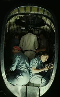 Working inside fuselage of a Liberator Bomber, Consolidated Aircraft Corp., Fort Worth, Texas, 1942