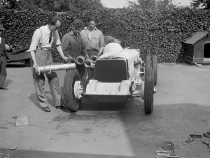 Working on Raymond Mays Vauxhall-Villiers, c1930s. Artist: Bill Brunell