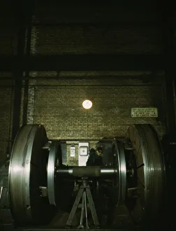 Railroad Shop Prints: Worn tires on locomotive wheels are refaced on this machine in the wheel shop