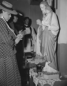 Safety Film Negatives Gmgpc Collection: Worshipper before the altar of the St. Martins Spiritual Church, Washington, D.C. 1942