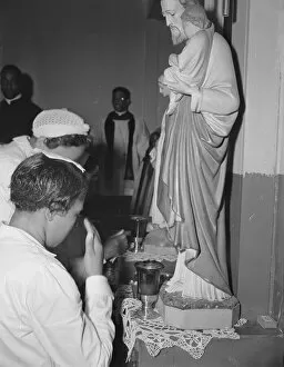 Worshippers before the altar in the St. Martin's Spiritual Church, Washington, D.C. 1942. Creator: Gordon Parks