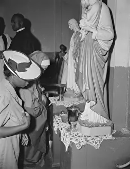 Worshippers before the altar in the St. Martins Spiritual Church, Washington, D. C. 1942. Creator: Gordon Parks